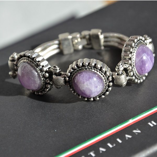 Mooie luxe stalen armband met paarse stenen
