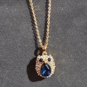 Goudkleurige uitjes ketting met kristal en glimmertjes